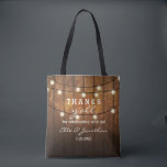 Rustic Barn Wood Country Wedding Thanks Y'All Tote Bag<br><div class="desc">Thank your out of town wedding guests with this personalised tote bag featuring a rustic design with twinkle string lights set against a barn wood background. Fun text reads "Thanks y'all" for celebrating with us! Personalise with 5 lines of custom text. Use as a thank you bag for bridesmaids, groomsmen,...</div>