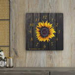 Rustic barn wood sunflower family farmhouse square wall clock<br><div class="desc">Rustic country style wall clock with a yellow gold sunflower over a dark brown barn wood background.               Personalise it with your family name and text!             It can be a beautiful keepsake gift for your family anniversary,  wedding,  couple shower,  housewarming.</div>