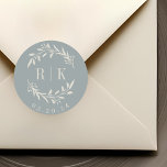 Rustic Blue Botanical Wreath Wedding Monogram Classic Round Sticker<br><div class="desc">Custom-designed botanical wedding monogram stickers featuring elegant white beige wreath with couple's initials and wedding date on dusty blue colour background. Perfect for wedding save the dates,  envelops,  wedding favour packagings and more.</div>