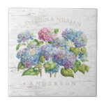 Rustic Blue Hydrangea Blooms with Wood Add Names Tile<br><div class="desc">If you love hydrangeas,  you'll certainly enjoy the lovely floral art on this tile. Blooming hydrangeas are shown in delightful shades from pink to blue to lavender,  with a wood board texture background.  Personalise the two first names above and the last name below to your own.</div>