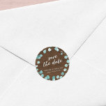 Rustic Eucalyptus and Brown Wood Save the Date Classic Round Sticker<br><div class="desc">This rustic wedding sticker features eucalyptus leaves with the words "save the date" in trendy script all against a brown wood background. Personalise it by replacing the placeholder text in the template to add your information. For more options such as to change the font and it's size/colour or the spacing...</div>