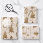 Rustic Gold Christmas Wrapping Paper Sheet<br><div class="desc">A coordinated set of gold Christmas trees and snowflakes over a wood plank background gift wrap sheets.</div>