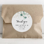 Rustic Gold Floral Thank You Wedding Favour Classic Round Sticker<br><div class="desc">This rustic gold floral thank you wedding favour classic round sticker is perfect for a simple wedding. This artistic design features hand-drawn gold floral and watercolor eucalyptus green foliage, inspiring natural beauty. Make the sticker labels your own by including your names, the event (if applicable), and the date. These stickers...</div>
