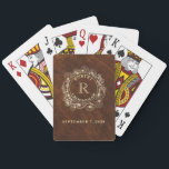 Rustic Groomsman Monogram Playing Cards<br><div class="desc">These custom groomsmen playing cards feature a vintage woodgrain background, gold floral wreath, and personalised name and initial. A unique and practical wedding party gift, these cards are perfect for bachelor parties, game night favours, or keepsakes for your groomsmen. Stylish yet functional, they add a fun and personal touch to...</div>