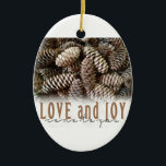 Rustic Holiday Love and Joy Pine Cone Ceramic Tree Decoration<br><div class="desc">Festive,  rustic pine cones accentuate this classic,  elegant design wishing holiday Love and Joy.</div>