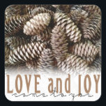 Rustic Holiday Love and Joy Pine Cone Square Sticker<br><div class="desc">Festive,  rustic pine cones accentuate this classic,  elegant design wishing holiday Love and Joy.</div>