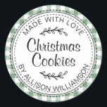 Rustic Homemade Christmas Cookies Green Check Classic Round Sticker<br><div class="desc">Rustic, modern and simple homemade baked goods apple pie sticker with the text made with love, Christmas cookies and your name in elegant handwritten script calligraphy and typography on a mineral green check pattern background with a stylish touch of foliage. Simply add your name and the product name to the...</div>