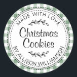 Rustic Homemade Christmas Cookies Green Check Classic Round Sticker<br><div class="desc">Rustic, modern and simple homemade baked goods apple pie sticker with the text made with love, Christmas cookies and your name in elegant handwritten script calligraphy and typography on a mineral green check pattern background with a stylish touch of foliage. Simply add your name and the product name to the...</div>