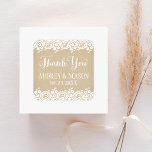 Rustic Kraft and Lace Wedding Thank You Square Sticker<br><div class="desc">Wedding favour stickers in square shape feature "Thank You" in white script,  a monogram of the bride and groom's names and wedding date,  a charming illustrated border design of floral lace,  and a background with a rustic kraft brown paper textured appearance.</div>