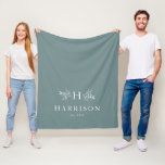 Rustic monogram teal newlywed blanket<br><div class="desc">As a coordinating piece of the Rustic Monogram collection by Lea Delaveris Design,  this blanket features a trendy soft sage teal colour background with a monogram surrounded by branches along with a last name and established date. Matching pillow available. Perfect for a newlywed gift or bridal shower gift!</div>