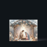 Rustic Nativity Scene with Winter Florals Card<br><div class="desc">This serene nativity scene captures the peaceful beauty of the Holy Family beneath a rustic wooden stable, gently lit by lanterns and surrounded by soft snowfall. The design features Mary, Joseph, and baby Jesus in a warm, reverent moment, accentuated by delicate winter florals, snow-covered pine branches, and glowing string lights....</div>