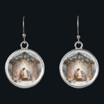 Rustic Nativity Scene with Winter Florals Earrings<br><div class="desc">This serene nativity scene captures the peaceful beauty of the Holy Family beneath a rustic wooden stable, gently lit by lanterns and surrounded by soft snowfall. The design features Mary, Joseph, and baby Jesus in a warm, reverent moment, accentuated by delicate winter florals, snow-covered pine branches, and glowing string lights....</div>