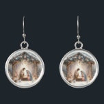 Rustic Nativity Scene with Winter Florals Earrings<br><div class="desc">This serene nativity scene captures the peaceful beauty of the Holy Family beneath a rustic wooden stable, gently lit by lanterns and surrounded by soft snowfall. The design features Mary, Joseph, and baby Jesus in a warm, reverent moment, accentuated by delicate winter florals, snow-covered pine branches, and glowing string lights....</div>