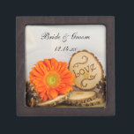 Rustic Orange Daisy Woodland Wedding Gift Box<br><div class="desc">Carry your rings down the aisle in a charming personalised Rustic Orange Daisy Woodland Wedding Gift Box. This custom outdoors woods or forest wedding trinket box features a quaint digitally enhanced nature photograph of an orange daisy flower blossom, natural wood slices with the word LOVE on it, brown pines cone...</div>