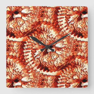Rustic repetition of reddish coral rosettes carved square wall clock