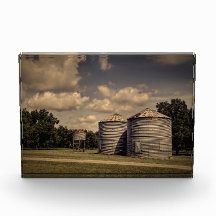 Rustic Silos in a Sleepy Scene Under Fluffy Clouds