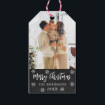 Rustic Snowflake Chalkboard Photo Christmas  Gift Tags<br><div class="desc">Rustic Chalkboard Snowflakes Family Photo Christmas Gift Tags. Featuring a single photo with 'Merry Christmas' calligraphy and your family name and year on black chalkboard background. The rustic snowy, minimalist design adds a touch of sophistication to your holiday gifts, ensuring they stand out this season! The displayed family photo is...</div>