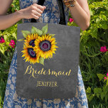 Rustic sunflowers chalkboard wedding bridesmaid tote bag<br><div class="desc">Rustic elegant fall wedding stylish bridesmaid / maid of honour / flower girl tote bag on dark grey chalkboard featuring beautiful yellow gold sunflowers bouquets . Personalise it with bridesmaid's name on front and with bride's and groom's names and wedding date on the back. ------- Fill in your information in...</div>