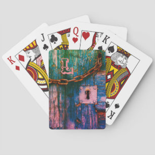 Rustic wood door keyhole and chain playing cards