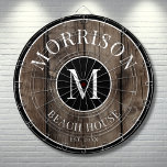 Rustic Wood Family Name  Dartboard<br><div class="desc">This rustic dartboard is the perfect addition to your family beach house, lake house, game room, man cave, and more. It features a bold initial monogram at the centre, with your family name proudly displayed at the top. The bottom reads "Beach House, " but this can be customised to fit...</div>