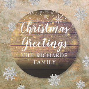 Rustic Wood Script Christmas Greetings Family Name Classic Round Sticker