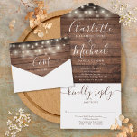 Rustic Wood String Lights Monogram Wedding  All In One Invitation<br><div class="desc">All in one wedding invitation with pretty string lights,  signature style names and chic typography on a rustic wood background. The invitation includes a perforated RSVP card that can be individually addressed or left blank for you to handwrite your guest's address details. Designed by Thisisnotme©</div>