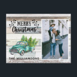 Rustic Wood Vintage Truck Script  Christmas Photo Holiday Postcard<br><div class="desc">Rustic Wood Vintage Truck Script Christmas Photo Holiday Postcard - Rustic Christmas postcard reads "Merry Christmas" with a pretty script font accented with berry sprigs. A vintage pick up is carrying Christmas trees, fresh from the farm. The truck is decorated with string lights. Your photo is featured with your family...</div>