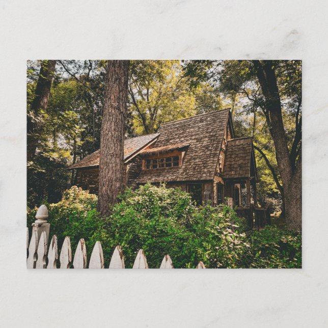 Rustic Wooden Cabin in Forest with Picket Fence Postcard (Front)