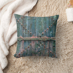 Rustic wooden gate and iron in blue cushion