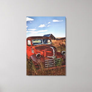 Rusting orange Dodge truck with abandoned farm Canvas Print