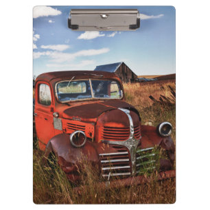 Rusting orange Dodge truck with abandoned farm Clipboard
