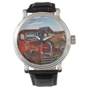 Rusting orange Dodge truck with abandoned farm Watch