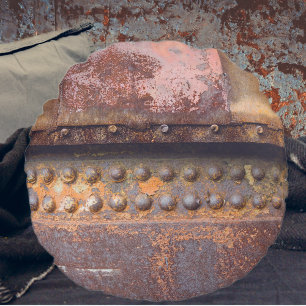 Rusty pink brown metal round cushion