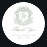 Sage Green Monogram Wedding Crest Thank You Classic Round Sticker<br><div class="desc">These elegant sage green classic wedding monogram thank you stickers are perfect for favors, place cards, and more. They feature an ornate vintage crest with intertwined fancy script calligraphy monogram, and script Thank You. Find matching products in the collection, or message me through Zazzle Chat for more products and design...</div>