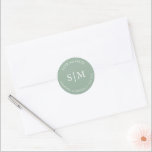 Sage Green Wedding Monogrammed Classic Round Sticker<br><div class="desc">These wedding stickers feature the bride and groom name's,  monogrammed initials and wedding date in white over a solid sage green colour. Use them for your wedding envelope seals. To see matching items by Victoria Grigaliunas visit DoTellABelle on Zazzle at www.zazzle.com/dotellabelle</div>