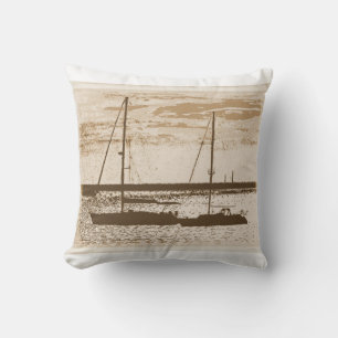 Sail boats on shore at dusk cushion