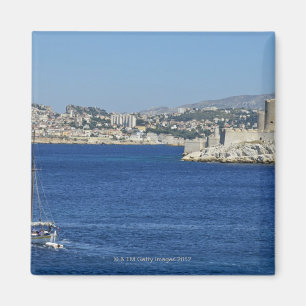 Sailboat cruising by Chateau d'If in Marseille's Magnet