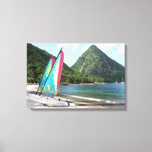 Sailing Boat and water sports equipment on a beach Canvas Print