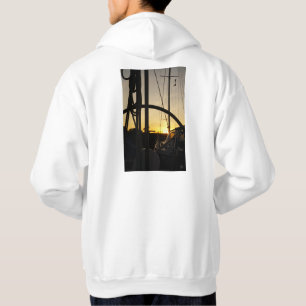 Sailing yacht steering wheel with setting sun. hoodie