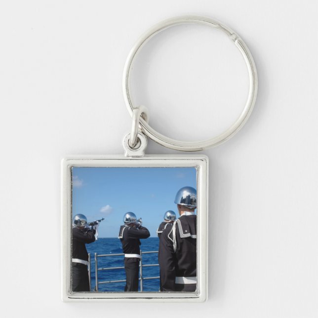 Sailors fire a gun salute during a burial-at-se key ring (Front)