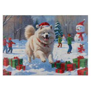 Samoyed Running in Snow with Christmas Hat Cutting Board