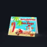 San Diego Christmas Santa and Surfboards Beach Holiday Card<br><div class="desc">This Merry Christmas holiday greeting card features Santa Clause at a San Diego Beach. He is relaxing with his surfboards, enjoying the sun, palm trees and his pipe. Inside Greeting ~ "Warmest Wishes from our Holiday Paradise to yours... ". All of the text, on this greeting card, can be personalised...</div>