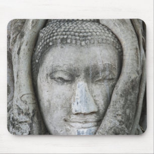 Sandstone head of Buddha surrounded by tree Mouse Pad