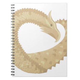 Sandstone heart dragon on white notebook