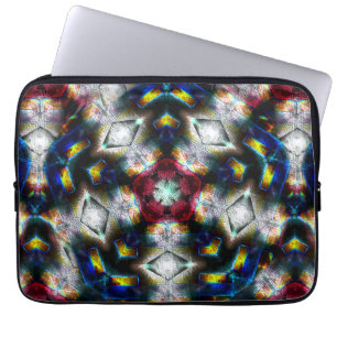 Sandy base with shapes in dark colours and lightin laptop sleeve