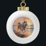 Sandy Paws Alaskan Malamute Dog on Beach Sunset Ceramic Ball Christmas Ornament<br><div class="desc">Immerse yourself in the tranquil beauty of our "Sandy Paws and Sunset Hues" dog on beach sunset design. This captivating scene captures the essence of a perfect evening at the shore, with a loyal canine companion enjoying the golden sands and the breathtaking hues of the setting sun. Whether you're a...</div>