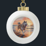 Sandy Paws Alaskan Malamute Dog on Beach Sunset Ceramic Ball Christmas Ornament<br><div class="desc">Immerse yourself in the tranquil beauty of our "Sandy Paws and Sunset Hues" dog on beach sunset design. This captivating scene captures the essence of a perfect evening at the shore, with a loyal canine companion enjoying the golden sands and the breathtaking hues of the setting sun. Whether you're a...</div>