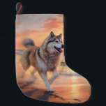 Sandy Paws Alaskan Malamute Dog on Beach Sunset Small Christmas Stocking<br><div class="desc">Immerse yourself in the tranquil beauty of our "Sandy Paws and Sunset Hues" dog on beach sunset design. This captivating scene captures the essence of a perfect evening at the shore, with a loyal canine companion enjoying the golden sands and the breathtaking hues of the setting sun. Whether you're a...</div>