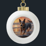 Sandy Paws Australian Cattle Dog on Beach Sunset Ceramic Ball Christmas Ornament<br><div class="desc">Immerse yourself in the tranquil beauty of our "Sandy Paws and Sunset Hues" dog on beach sunset design. This captivating scene captures the essence of a perfect evening at the shore, with a loyal canine companion enjoying the golden sands and the breathtaking hues of the setting sun. Whether you're a...</div>