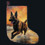 Sandy Paws Belgian Malinois Dog on Beach Sunset  Small Christmas Stocking<br><div class="desc">Immerse yourself in the tranquil beauty of our "Sandy Paws and Sunset Hues" dog on beach sunset design. This captivating scene captures the essence of a perfect evening at the shore, with a loyal canine companion enjoying the golden sands and the breathtaking hues of the setting sun. Whether you're a...</div>